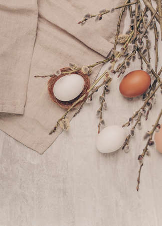 Easter eggs and willow branches on grey backgroundの写真素材
