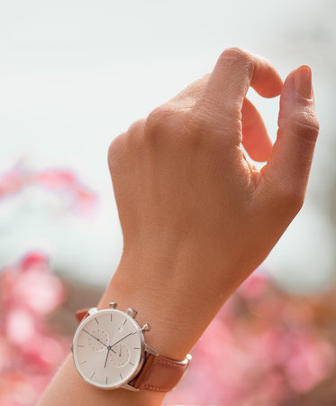 Stylish white watch on woman hand.の写真素材