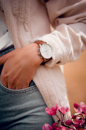 Stylish white watch on woman handの写真素材