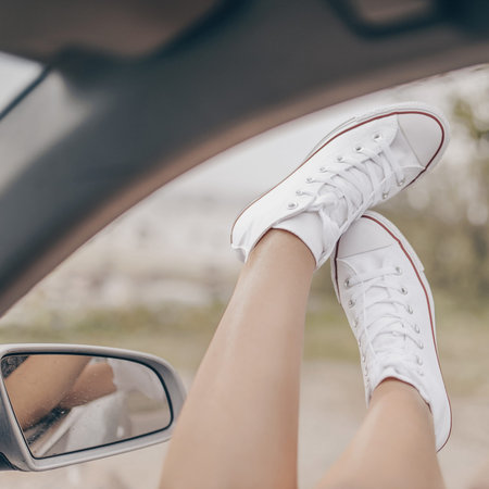 Fashion stylish retro white sneakers in outdoor. 