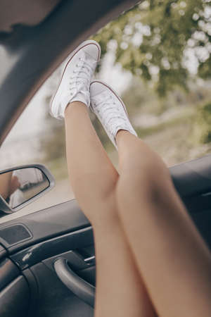 Fashion stylish retro white sneakers in outdoor. の写真素材