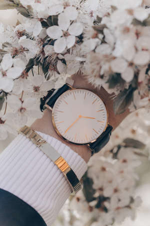 Stylish white watch on woman handの写真素材