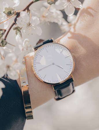 Stylish white watch on woman handの写真素材