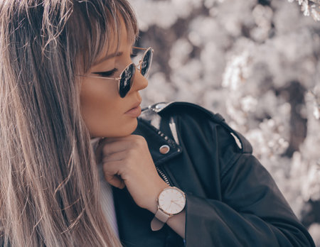 Stylish white watch on woman hand