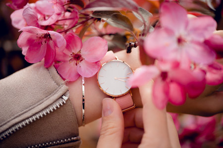 Stylish white watch on woman hand.の写真素材