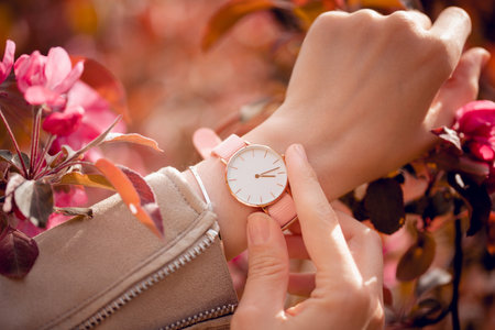 Stylish white watch on woman hand.の写真素材