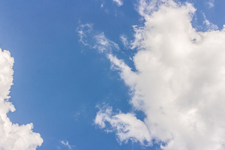 Landscape with blue sky and altocumulus white clouds beautiful blue sky background. Beauty clear cloudy in sunlight calm bright winter or summer windy air background.の写真素材