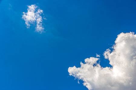 Landscape with blue sky and Cumulus white clouds beautiful blue sky background. Beauty clear cloudy in sunlight calm bright winter or summer windy air background.の写真素材