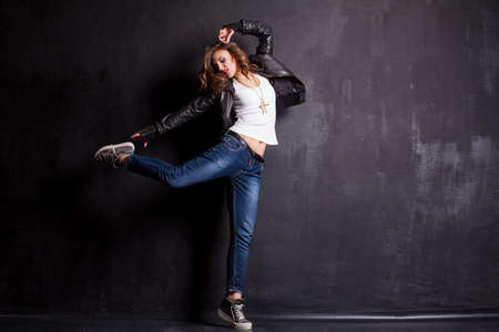 model girl dancing on a black backgroundの写真素材