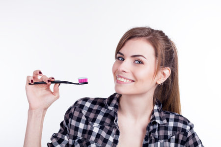 girl is going to brush teeth with a toothbrushの写真素材