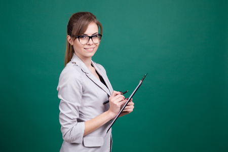 girl teacher with a folder and penの写真素材