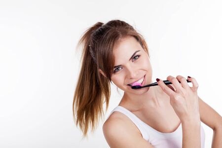 the girl brush teeth with a toothbrushの写真素材
