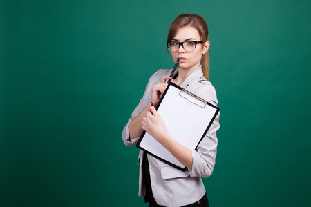 girl teacher with a folder and penの写真素材