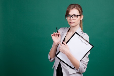 girl teacher with a folder and penの写真素材