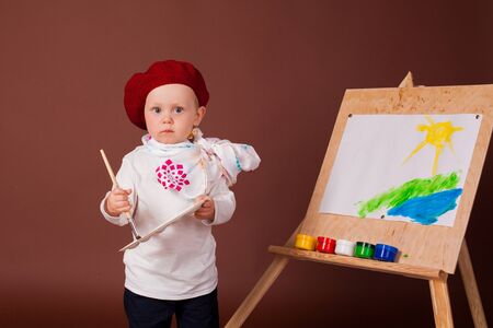 The young artist at easel in studioの写真素材