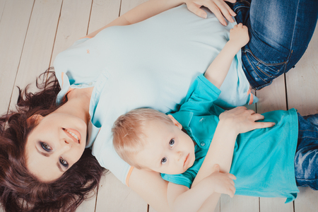 mom and little son together in studioの写真素材