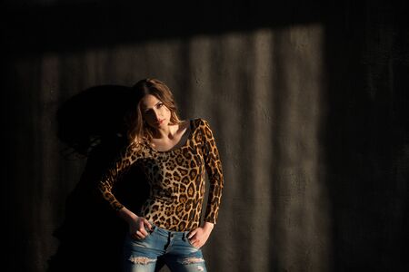 girl model stands on a black backgroundの写真素材