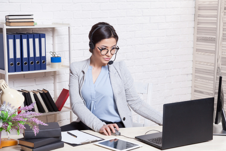 the girl in the Office as call center operatorの写真素材