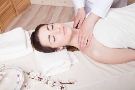 girl doing massage in the Spaの写真素材