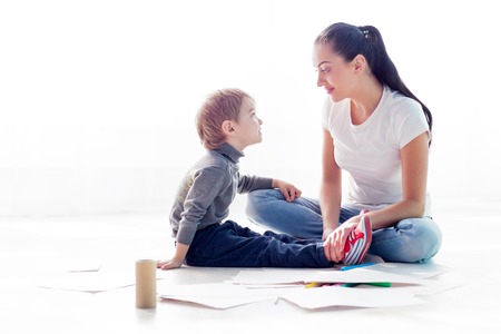 mother draws with little boy kidの写真素材