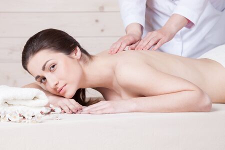 nice girl doing massage in the Spaの写真素材