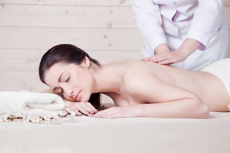 nice girl doing massage in the Spaの写真素材