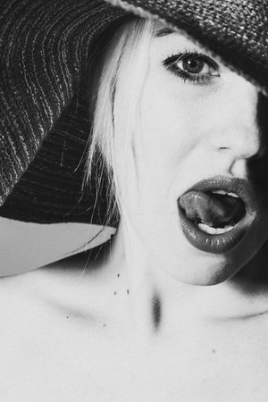 black and white photo of a girl in a hatの写真素材