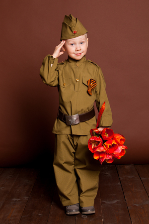 Portrait of a boy soldier in foto studioの写真素材