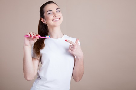 girl with a toothbrush in foto studioの写真素材