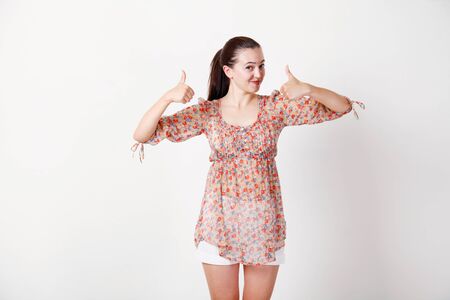 beautiful girl shows class good on backgroundの写真素材