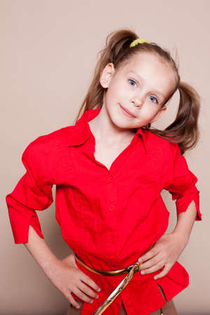 beautiful little girl with pigtails Hamming in studioの写真素材