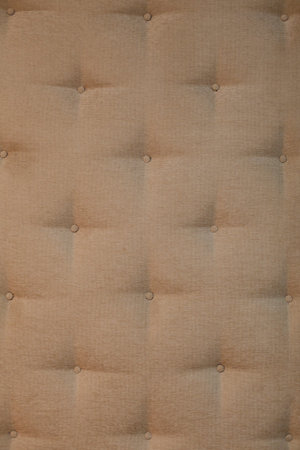 background of soft beige fabric textured wall