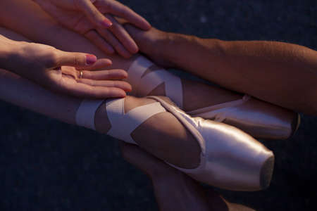 at the feet of dancers wearing Pointe Shoesの写真素材