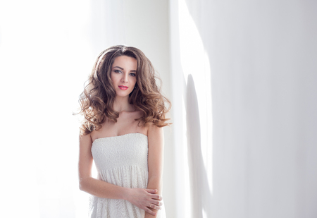 girl model posing in a white roomの写真素材