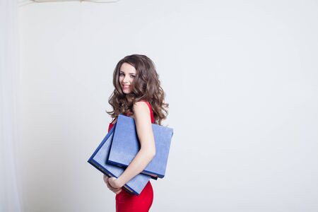 girl in red dress Manager with foldersの写真素材