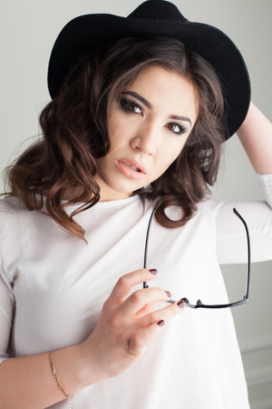 pretty girl with glasses and hat