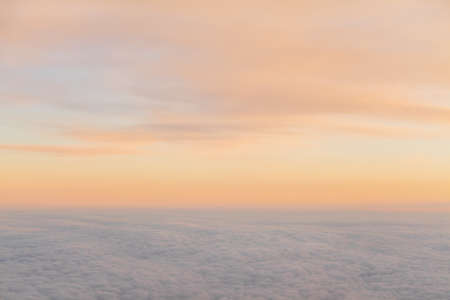 beautiful sunset above the clouds from aircraft 1の写真素材