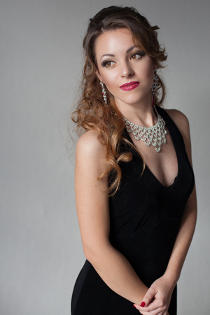 beautiful girl in black evening dress cocktail partyの写真素材