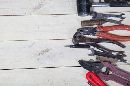 many tools for repairs lies on the white boardsの写真素材