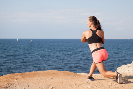 woman goes in for Sports Fitness on the beach