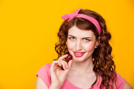 a girl holds the Berry eats grapesの写真素材