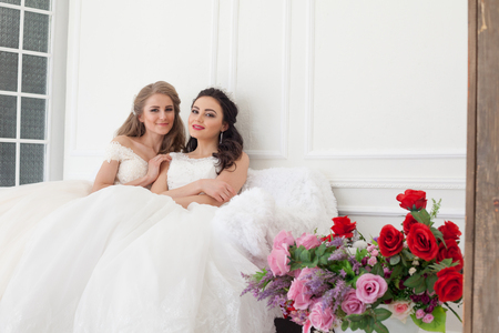 two brides on wedding wedding blonde brunette girlfriendの写真素材
