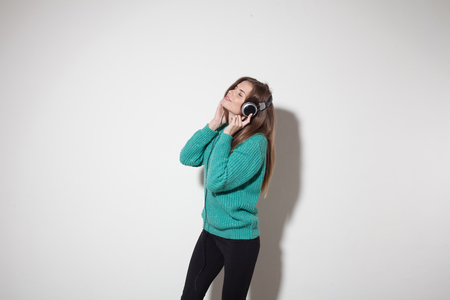 beautiful girl listens to music in headphonesの写真素材