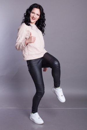 beautiful stylish girl shows fingersの写真素材