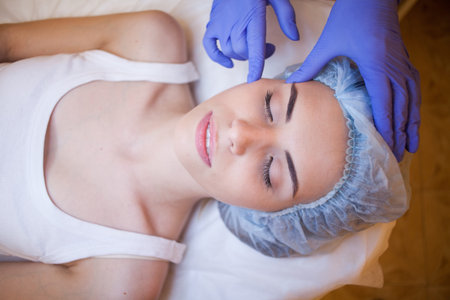 Cosmetology doctor doing massage person woman