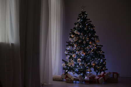 garlands of lights on a Christmas tree for Christmas Decorの写真素材