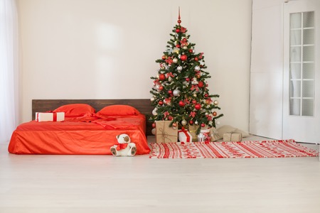 bedroom with Christmas new year tree decoration bedの写真素材