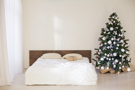 bedroom with christmas new year tree decoration bedの写真素材