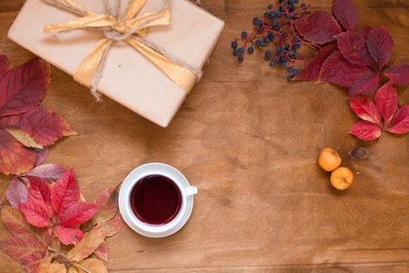 background of yellow autumn leaves Tea Cup and foodの写真素材