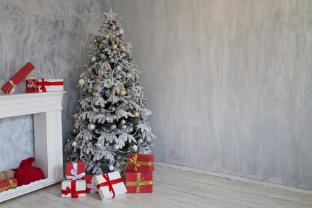 Interior of the room with the Christmas tree and Christmas giftsの写真素材